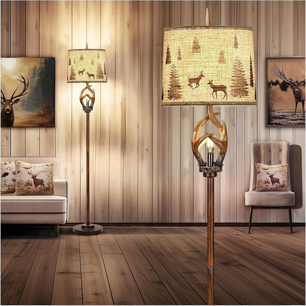 The Scenekoy Rustic Farmhouse Antlers Floor Lamp Nightlight, featuring a brown finish and round shade, adds charm to a rustic living room decorated with wood paneling, animal art, and nature-inspired accents.